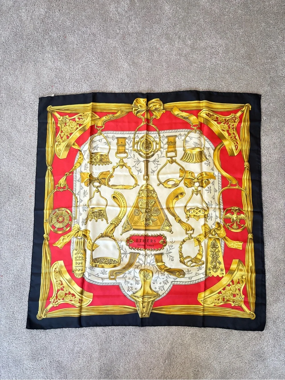 Hermès silk scarf in gold, red and black ornate print